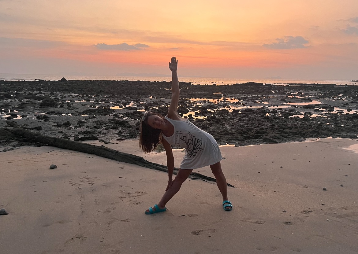 Kelley Pullman stretching during sunset